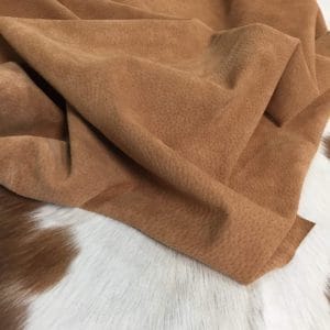 What is pig Leather Pig Leather collection - a range of leather products crafted from split suede material with a velvety texture. This leather is not only incredibly soft but also comes in a stunning array of colors that are sure to please any fashion enthusiast. The collection's versatile hues are perfect for creating a variety of atmospheres, from a dark and mystical ambiance to a pastel and dreamy feel. Whether you're looking to line a garment, create a handbag, or design footwear, this leather is sure to impress. With a whole hide ranging from 7-9 square feet and a thickness of 0.6-0.8 mm, you'll get to experience the beauty of a high-quality material that is both durable and stylish.