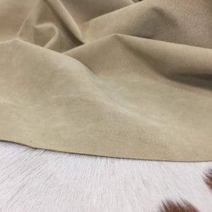 What is pig Leather Pig Leather collection - a range of leather products crafted from split suede material with a velvety texture. This leather is not only incredibly soft but also comes in a stunning array of colors that are sure to please any fashion enthusiast. The collection's versatile hues are perfect for creating a variety of atmospheres, from a dark and mystical ambiance to a pastel and dreamy feel. Whether you're looking to line a garment, create a handbag, or design footwear, this leather is sure to impress. With a whole hide ranging from 7-9 square feet and a thickness of 0.6-0.8 mm, you'll get to experience the beauty of a high-quality material that is both durable and stylish.