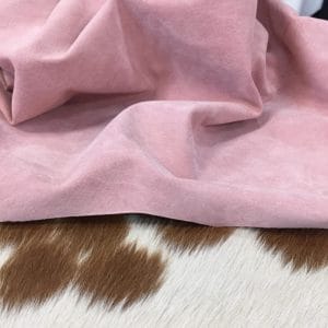 What is pig Leather Pig Leather collection - a range of leather products crafted from split suede material with a velvety texture. This leather is not only incredibly soft but also comes in a stunning array of colors that are sure to please any fashion enthusiast. The collection's versatile hues are perfect for creating a variety of atmospheres, from a dark and mystical ambiance to a pastel and dreamy feel. Whether you're looking to line a garment, create a handbag, or design footwear, this leather is sure to impress. With a whole hide ranging from 7-9 square feet and a thickness of 0.6-0.8 mm, you'll get to experience the beauty of a high-quality material that is both durable and stylish.