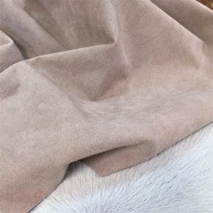 What is pig Leather Pig Leather collection - a range of leather products crafted from split suede material with a velvety texture. This leather is not only incredibly soft but also comes in a stunning array of colors that are sure to please any fashion enthusiast. The collection's versatile hues are perfect for creating a variety of atmospheres, from a dark and mystical ambiance to a pastel and dreamy feel. Whether you're looking to line a garment, create a handbag, or design footwear, this leather is sure to impress. With a whole hide ranging from 7-9 square feet and a thickness of 0.6-0.8 mm, you'll get to experience the beauty of a high-quality material that is both durable and stylish.