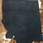 Premium quality black veg-tanned tooling and stamping leather is an excellent choice for your projects, as it undergoes a 100% vegetable tanning process through a drum process. All selections go through the same process, which guarantees quality in rupture, moisture, water penetration, and flexibility. This leather is ideal for use in crafting straps, belts, cinches, pet collars and leashes, footwear, holsters and sheaths, and strops. It is made from cowhide (double shoulder) and is 8-9 oz. thick (3.2 - 3.6 mm). The color is charcoal black (struck-through), and the average hide size is 14-17 sq. ft. The texture is smooth, and the temper is stiff. It is 100% veg-tanned and comes from Mexico.