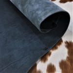 Premium quality black veg-tanned tooling and stamping leather is an excellent choice for your projects, as it undergoes a 100% vegetable tanning process through a drum process. All selections go through the same process, which guarantees quality in rupture, moisture, water penetration, and flexibility. This leather is ideal for use in crafting straps, belts, cinches, pet collars and leashes, footwear, holsters and sheaths, and strops. It is made from cowhide (double shoulder) and is 8-9 oz. thick (3.2 - 3.6 mm). The color is charcoal black (struck-through), and the average hide size is 14-17 sq. ft. The texture is smooth, and the temper is stiff. It is 100% veg-tanned and comes from Mexico.