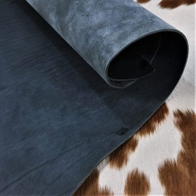 Premium quality black veg-tanned tooling and stamping leather is an excellent choice for your projects, as it undergoes a 100% vegetable tanning process through a drum process. All selections go through the same process, which guarantees quality in rupture, moisture, water penetration, and flexibility. This leather is ideal for use in crafting straps, belts, cinches, pet collars and leashes, footwear, holsters and sheaths, and strops. It is made from cowhide (double shoulder) and is 8-9 oz. thick (3.2 - 3.6 mm). The color is charcoal black (struck-through), and the average hide size is 14-17 sq. ft. The texture is smooth, and the temper is stiff. It is 100% veg-tanned and comes from Mexico.