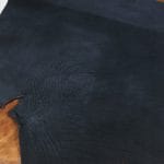 Premium quality black veg-tanned tooling and stamping leather is an excellent choice for your projects, as it undergoes a 100% vegetable tanning process through a drum process. All selections go through the same process, which guarantees quality in rupture, moisture, water penetration, and flexibility. This leather is ideal for use in crafting straps, belts, cinches, pet collars and leashes, footwear, holsters and sheaths, and strops. It is made from cowhide (double shoulder) and is 8-9 oz. thick (3.2 - 3.6 mm). The color is charcoal black (struck-through), and the average hide size is 14-17 sq. ft. The texture is smooth, and the temper is stiff. It is 100% veg-tanned and comes from Mexico.