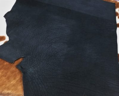 Premium quality black veg-tanned tooling and stamping leather is an excellent choice for your projects, as it undergoes a 100% vegetable tanning process through a drum process. All selections go through the same process, which guarantees quality in rupture, moisture, water penetration, and flexibility. This leather is ideal for use in crafting straps, belts, cinches, pet collars and leashes, footwear, holsters and sheaths, and strops. It is made from cowhide (double shoulder) and is 8-9 oz. thick (3.2 - 3.6 mm). The color is charcoal black (struck-through), and the average hide size is 14-17 sq. ft. The texture is smooth, and the temper is stiff. It is 100% veg-tanned and comes from Mexico.