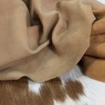The Lambskin Nubuck Leather Collection is a luxurious soft velvet 2oz leather with an average hide size of 6-8 sq. ft. It's perfect for various items such as apparel, handbags, and accessories.