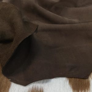 The Nubuck Lambskin Collection is a type of leather that feels soft and luxurious, with a trendy and eye-catching appearance. The leather undergoes a unique tanning process that involves lightly buffing the grain surface, resulting in a very soft and pleasing texture. This leather is suitable for various applications, including apparel, moccasins, toy and doll clothing, lining, handbags, shoes, and accessories. The leather comes in full hide specification, with an average size of 6-8 square feet. It is made from lamb skin and has a nubuck finish. The leather thickness is 2 oz (0.7-0.9mm)