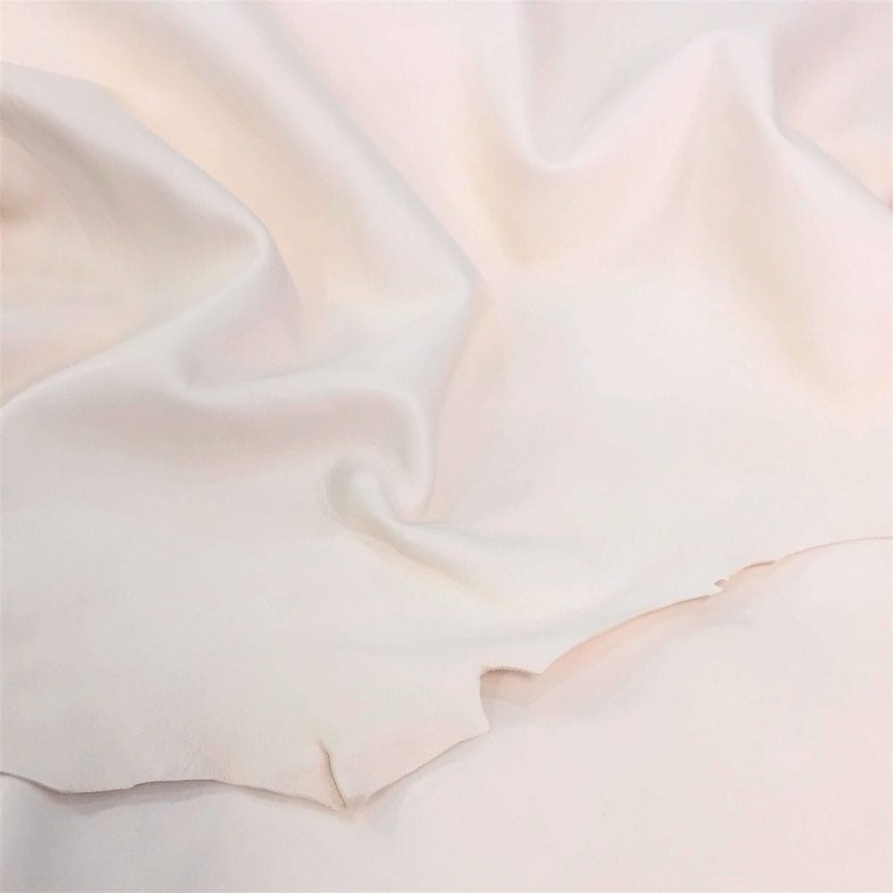 NATURAL VEG TAN Lambskin avetcoinc@ Natural Veg Tanned Lambskin Leather is perfect for various projects. It is 100% vegetable-tanned using a drum process, resulting in high-quality leather that is durable and flexible while being resistant to rupture, moisture, and water penetration.