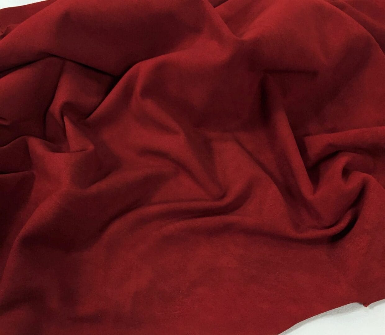 Scarlet Red Lambskin suede avetcoinc@ Goatskin Garment Suede Leather 5-7 square feet hide Leather 1.5oz thick soft and easy to use Suitable for shoes footwear handbags garments shirts jackets vests What is Goat Suede? Goat suede undergoes an extra finishing process that creates a velvety texture. This process involves buffing the flesh side of the hide, resulting in a soft and textured nap that feels wonderful to the touch.