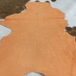 Tangerine (4) | Avetco Leather Hides and Eva Foam This Economy Goat Suede Leather is a soft and luxurious material that adds a chic touch to any style. It's perfect for creating accessories, handbags, shoes, belts, and apparel. The leather weighs 3oz and has a thickness of 1.0-1.2mm, with an average hide size of 2-3sq ft. The leather has a medium soft temper and was tanned using chrome. It may have some blemishes or holes, but it's still a high-quality manufacturing grade B leather. Originating from Italy, this suede leather is irresistible to the touch.