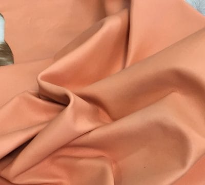 Lambskin Leather Grade C is a type of leather that might have some imperfections, but they do not affect its performance. Instead, these flaws give it a unique appearance. The leather's raw material is sourced from sheep or lamb, and it weighs 2 oz. with a thickness of 0.7-0.9 mm. Furthermore, the economy grade Lamb leather may have uneven shade tone, dark spots, stretch marks, scarring, scratches, or a few holes. However, these flaws do not affect its performance. Instead, they give it a unique appearance that sets it apart from other types of leather.
