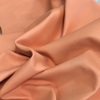 Lambskin Leather Grade C is a type of leather that might have some imperfections, but they do not affect its performance. Instead, these flaws give it a unique appearance. The leather's raw material is sourced from sheep or lamb, and it weighs 2 oz. with a thickness of 0.7-0.9 mm. Furthermore, the economy grade Lamb leather may have uneven shade tone, dark spots, stretch marks, scarring, scratches, or a few holes. However, these flaws do not affect its performance. Instead, they give it a unique appearance that sets it apart from other types of leather.