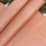Lambskin Leather Grade C is a type of leather that might have some imperfections, but they do not affect its performance. Instead, these flaws give it a unique appearance. The leather's raw material is sourced from sheep or lamb, and it weighs 2 oz. with a thickness of 0.7-0.9 mm. Furthermore, the economy grade Lamb leather may have uneven shade tone, dark spots, stretch marks, scarring, scratches, or a few holes. However, these flaws do not affect its performance. Instead, they give it a unique appearance that sets it apart from other types of leather.