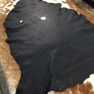 Lambskin Leather Grade C is a type of leather that might have some imperfections, but they do not affect its performance. Instead, these flaws give it a unique appearance. The leather's raw material is sourced from sheep or lamb, and it weighs 2 oz. with a thickness of 0.7-0.9 mm. Furthermore, the economy grade Lamb leather may have uneven shade tone, dark spots, stretch marks, scarring, scratches, or a few holes. However, these flaws do not affect its performance. Instead, they give it a unique appearance that sets it apart from other types of leather.