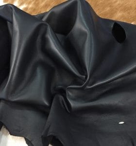 Lambskin Leather Grade C is a type of leather that might have some imperfections, but they do not affect its performance. Instead, these flaws give it a unique appearance. The leather's raw material is sourced from sheep or lamb, and it weighs 2 oz. with a thickness of 0.7-0.9 mm. Furthermore, the economy grade Lamb leather may have uneven shade tone, dark spots, stretch marks, scarring, scratches, or a few holes. However, these flaws do not affect its performance. Instead, they give it a unique appearance that sets it apart from other types of leather.