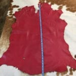 Lambskin Leather Grade C is a type of leather that might have some imperfections, but they do not affect its performance. Instead, these flaws give it a unique appearance. The leather's raw material is sourced from sheep or lamb, and it weighs 2 oz. with a thickness of 0.7-0.9 mm. Furthermore, the economy grade Lamb leather may have uneven shade tone, dark spots, stretch marks, scarring, scratches, or a few holes. However, these flaws do not affect its performance. Instead, they give it a unique appearance that sets it apart from other types of leather.