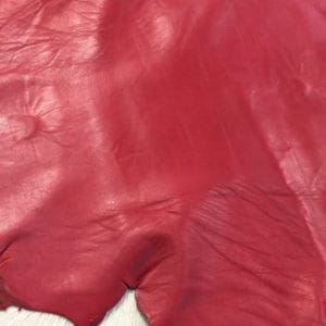 Lambskin Leather Grade C is a type of leather that might have some imperfections, but they do not affect its performance. Instead, these flaws give it a unique appearance. The leather's raw material is sourced from sheep or lamb, and it weighs 2 oz. with a thickness of 0.7-0.9 mm. Furthermore, the economy grade Lamb leather may have uneven shade tone, dark spots, stretch marks, scarring, scratches, or a few holes. However, these flaws do not affect its performance. Instead, they give it a unique appearance that sets it apart from other types of leather.