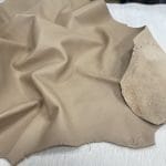 Lambskin Leather Grade C is a type of leather that might have some imperfections, but they do not affect its performance. Instead, these flaws give it a unique appearance. The leather's raw material is sourced from sheep or lamb, and it weighs 2 oz. with a thickness of 0.7-0.9 mm. Furthermore, the economy grade Lamb leather may have uneven shade tone, dark spots, stretch marks, scarring, scratches, or a few holes. However, these flaws do not affect its performance. Instead, they give it a unique appearance that sets it apart from other types of leather.