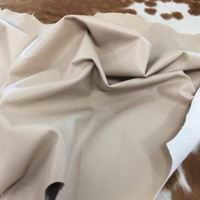 Lambskin Leather Grade C is a type of leather that might have some imperfections, but they do not affect its performance. Instead, these flaws give it a unique appearance. The leather's raw material is sourced from sheep or lamb, and it weighs 2 oz. with a thickness of 0.7-0.9 mm. Furthermore, the economy grade Lamb leather may have uneven shade tone, dark spots, stretch marks, scarring, scratches, or a few holes. However, these flaws do not affect its performance. Instead, they give it a unique appearance that sets it apart from other types of leather.
