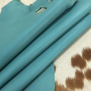Lambskin Leather Grade C is a type of leather that might have some imperfections, but they do not affect its performance. Instead, these flaws give it a unique appearance. The leather's raw material is sourced from sheep or lamb, and it weighs 2 oz. with a thickness of 0.7-0.9 mm. Furthermore, the economy grade Lamb leather may have uneven shade tone, dark spots, stretch marks, scarring, scratches, or a few holes. However, these flaws do not affect its performance. Instead, they give it a unique appearance that sets it apart from other types of leather.