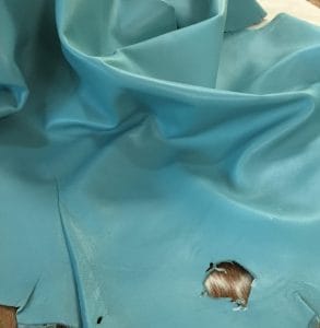 Lambskin Leather Grade C is a type of leather that might have some imperfections, but they do not affect its performance. Instead, these flaws give it a unique appearance. The leather's raw material is sourced from sheep or lamb, and it weighs 2 oz. with a thickness of 0.7-0.9 mm. Furthermore, the economy grade Lamb leather may have uneven shade tone, dark spots, stretch marks, scarring, scratches, or a few holes. However, these flaws do not affect its performance. Instead, they give it a unique appearance that sets it apart from other types of leather.