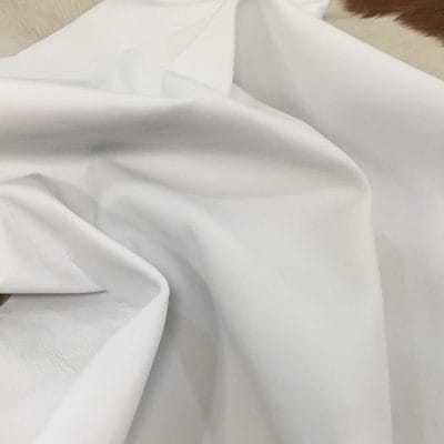 Lambskin Leather Grade C is a type of leather that might have some imperfections, but they do not affect its performance. Instead, these flaws give it a unique appearance. The leather's raw material is sourced from sheep or lamb, and it weighs 2 oz. with a thickness of 0.7-0.9 mm. Furthermore, the economy grade Lamb leather may have uneven shade tone, dark spots, stretch marks, scarring, scratches, or a few holes. However, these flaws do not affect its performance. Instead, they give it a unique appearance that sets it apart from other types of leather. The leather has a semi-gloss finish, which adds to its aesthetic appeal. Additionally, its soft-medium temper makes it pliable and easy to work with. In terms of size, the average hide size for economy grade Lamb leather is 6-8 sq. ft. With this size, you can use this type of leather for making accessories, arts and crafts, shoes, apparel, and more. Its versatility and unique appearance make it an excellent choice for various projects.