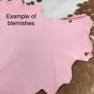 Lambskin Leather Grade C is a type of leather that might have some imperfections, but they do not affect its performance. Instead, these flaws give it a unique appearance. The leather's raw material is sourced from sheep or lamb, and it weighs 2 oz. with a thickness of 0.7-0.9 mm. Furthermore, the economy grade Lamb leather may have uneven shade tone, dark spots, stretch marks, scarring, scratches, or a few holes. However, these flaws do not affect its performance. Instead, they give it a unique appearance that sets it apart from other types of leather.