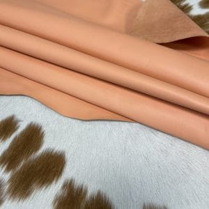 The Lambskin Leather Collection is a testament to the beauty of nature and the art of leather crafting. Made from high-quality full-grain leather with a semi-veg finish, this collection exudes an authentic and naturally worn appearance that is both timeless and luxurious. The smooth and silky texture of the leather provides a comfortable and stylish option for creating handbags, shoes, garments, and accessories.