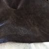 Distressed pig grain leather hide with natural grain texture