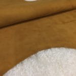 The Goatskin Suede Leather features a wonderful texture that is eye-catching and feels luxurious to the touch. Its versatility stems from a distinctive tanning method that involves gentle buffing, making it ideal for use in various items such as clothing, moccasins, lining, handbags, shoes, and accessories. Those who value timeless elegance and quality will undoubtedly find this leather worth the investment, as it guarantees utmost quality and worth through full hide pieces that typically range in size between 2-4 square feet and have a thickness of 3 oz (1.0-1.1mm). What is Goat Suede? Goat suede undergoes an extra finishing process that creates a velvety texture. This process involves buffing the flesh side of the hide, resulting in a soft and textured nap that feels wonderful to the touch.
