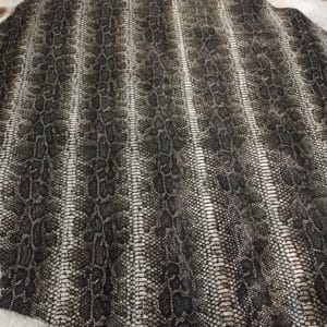 This Glazer Lambskin Article is a beautiful snakeskin printed hide with a combination of exotic colors and warm tones. The leather itself is slightly textured with a bit of a stretch making it useful for many different projects. This eye-catching leather has a unique, yet sophisticated look that possesses modern-day fashion.