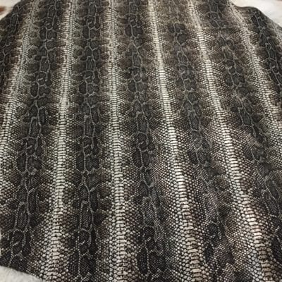 This Glazer Lambskin Article is a beautiful snakeskin printed hide with a combination of exotic colors and warm tones. The leather itself is slightly textured with a bit of a stretch making it useful for many different projects. This eye-catching leather has a unique, yet sophisticated look that possesses modern-day fashion.