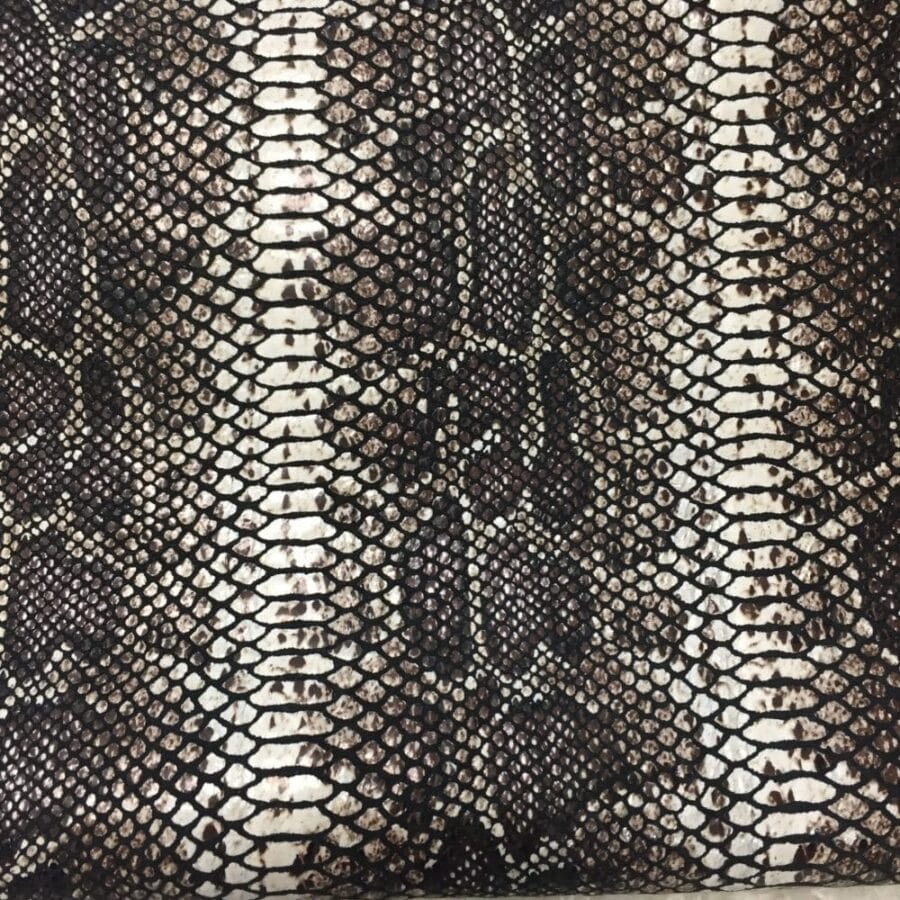 This Glazer Lambskin Article is a beautiful snakeskin printed hide with a combination of exotic colors and warm tones. The leather itself is slightly textured with a bit of a stretch making it useful for many different projects. This eye-catching leather has a unique, yet sophisticated look that possesses modern-day fashion.