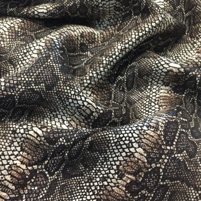 This Glazer Lambskin Article is a beautiful snakeskin printed hide with a combination of exotic colors and warm tones. The leather itself is slightly textured with a bit of a stretch making it useful for many different projects. This eye-catching leather has a unique, yet sophisticated look that possesses modern-day fashion.