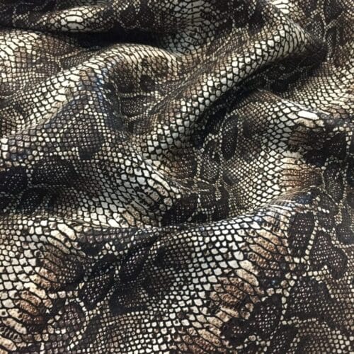 This Glazer Lambskin Article is a beautiful snakeskin printed hide with a combination of exotic colors and warm tones. The leather itself is slightly textured with a bit of a stretch making it useful for many different projects. This eye-catching leather has a unique, yet sophisticated look that possesses modern-day fashion.