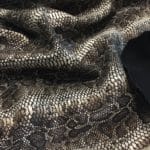 This Glazer Lambskin Article is a beautiful snakeskin printed hide with a combination of exotic colors and warm tones. The leather itself is slightly textured with a bit of a stretch making it useful for many different projects. This eye-catching leather has a unique, yet sophisticated look that possesses modern-day fashion.