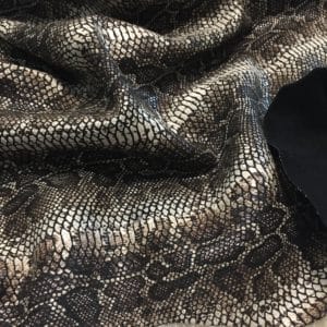 This Glazer Lambskin Article is a beautiful snakeskin printed hide with a combination of exotic colors and warm tones. The leather itself is slightly textured with a bit of a stretch making it useful for many different projects. This eye-catching leather has a unique, yet sophisticated look that possesses modern-day fashion.