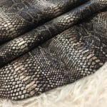 This Glazer Lambskin Article is a beautiful snakeskin printed hide with a combination of exotic colors and warm tones. The leather itself is slightly textured with a bit of a stretch making it useful for many different projects. This eye-catching leather has a unique, yet sophisticated look that possesses modern-day fashion.