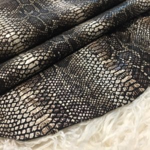 This Glazer Lambskin Article is a beautiful snakeskin printed hide with a combination of exotic colors and warm tones. The leather itself is slightly textured with a bit of a stretch making it useful for many different projects. This eye-catching leather has a unique, yet sophisticated look that possesses modern-day fashion.