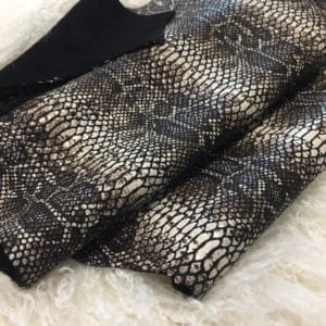 This Glazer Lambskin Article is a beautiful snakeskin printed hide with a combination of exotic colors and warm tones. The leather itself is slightly textured with a bit of a stretch making it useful for many different projects. This eye-catching leather has a unique, yet sophisticated look that possesses modern-day fashion.