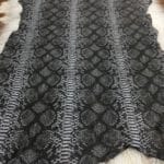 Rizzy Snake Lambskin avetcoinc@ (1) | Avetco Leather Hides and Eva Foam This Lambskin leather is a stunning hide printed with a captivating snakeskin pattern, featuring an alluring combination of exotic colors that sets it apart from other leathers. The leather has a slightly textured surface with a bit of stretch, making it highly versatile for various projects. This leather has a unique yet sophisticated appearance that complements modern fashion trends, making it a highly sought-after item in the fashion industry. It is highly versatile and perfect for creating a range of products such as apparel, wallets, accessories, handbags, shoes, and more. Its unique texture, pattern, and color combination make it an ideal choice for designers looking to create high-quality, fashionable products. This leather is made from high-quality Lambskin and features a unique snake print pattern that is highly desirable in the fashion industry. The leather is tanned using the Chrome tanning process, which gives it a unique texture and added durability. The average hide size is 7 square feet, making it perfect for creating a range of products, and the leather thickness ranges from 0.7 to 0.9 mm, giving it a soft and supple feel. The leather is sourced from Turkey, which is known for producing high-quality leathers that are sought after by designers around the world.