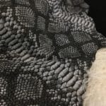 This Lambskin leather is a stunning hide printed with a captivating snakeskin pattern, featuring an alluring combination of exotic colors that sets it apart from other leathers. The leather has a slightly textured surface with a bit of stretch, making it highly versatile for various projects. This leather has a unique yet sophisticated appearance that complements modern fashion trends, making it a highly sought-after item in the fashion industry. It is highly versatile and perfect for creating a range of products such as apparel, wallets, accessories, handbags, shoes, and more. Its unique texture, pattern, and color combination make it an ideal choice for designers looking to create high-quality, fashionable products. This leather is made from high-quality Lambskin and features a unique snake print pattern that is highly desirable in the fashion industry. The leather is tanned using the Chrome tanning process, which gives it a unique texture and added durability. The average hide size is 7 square feet, making it perfect for creating a range of products, and the leather thickness ranges from 0.7 to 0.9 mm, giving it a soft and supple feel. The leather is sourced from Turkey, which is known for producing high-quality leathers that are sought after by designers around the world.