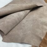 This exquisite collection features Pigskin Nubuck Leather, a suede with utmost softness that adds sophistication to any outfit. The timeless palette of natural colors perfectly complements the eye-catching hues, offering a versatile range of options. The suede's supple texture is incredibly tempting to the touch, and the leather comes from domestic pigs processed as whole hides with a thickness of 3 oz and an average size of 5-6 sq. ft. Additionally, the nubuck texture and medium soft temper of the suede perfectly highlight its exquisite suede texture. The leather is tanned using the chrome tannage method and is sourced from Taiwan. This exquisite collection is worth checking out, Perfect for footwear, accessories, handbags, apparel, belts, and DIY projects. What is Nubuck Leather? Top Grain Leather whose surface has been buffed and brushed to create a soft, velvety effect. Differs from suede in that while suede is created from the flesh (inner) side of a hide, nubuck is created using the grain (outer) side, giving it added strength and durability. You chose this leather because of its natural beauty, soft hand, and luxurious feel. Through years of experience, we have developed unique ways to maintain and protect these naturally tanned leathers. The lack of a coated finish requires special attention. What is Nubuck Leather?