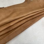 Florence is full-grain lambskin leather with an aniline finish, showcasing natural blemishes and rich character through transparent dyes for a raw, authentic look.