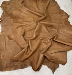Florence is full-grain lambskin leather with an aniline finish, showcasing natural blemishes and rich character through transparent dyes for a raw, authentic look.