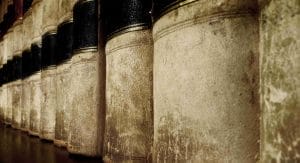 "Close-up of distressed leather book spines perfect for vintage fashion settings."