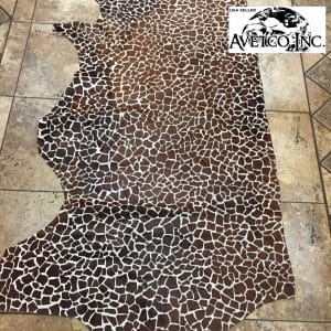 This chestnut cowhide features a bold giraffe print, offering a unique, exotic touch to any project. Perfect for handbags, upholstery, footwear, garments, pillows, and décor. Printed on premium hair-on cowhide for durability and natural texture with a wild, stylish edge. Each hide is one-of-a-kind—ideal for standout fashion and interior designs.