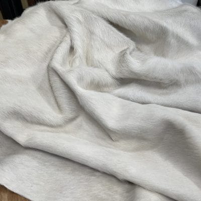Natural white cowhide with hair-on finish. Perfect for upholstery, décor, handbags, and fashion. Chrome tanned, soft, and durable with a clean, elegant look.