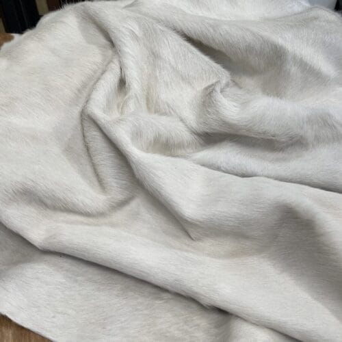 Natural white cowhide with hair-on finish. Perfect for upholstery, décor, handbags, and fashion. Chrome tanned, soft, and durable with a clean, elegant look.