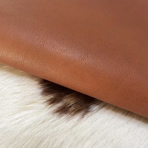 The Milano Cow Leather Collection is made of full-grain European leather produced from whole hides. This gives the leather a soft and luxurious finish on the surface, resulting in a subtle yet rich appearance. The collection is available in 48 complementary colors and is lightly pigmented and flexible, making it an excellent option for cutting. The Milano Collection is unbuffed and chrome-tanned, giving these leathers a smooth and elegant look.